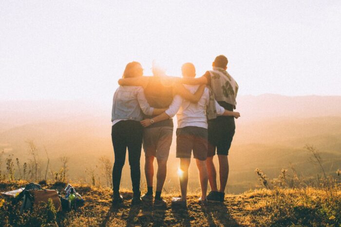 Supportive Group of People looking at the sun