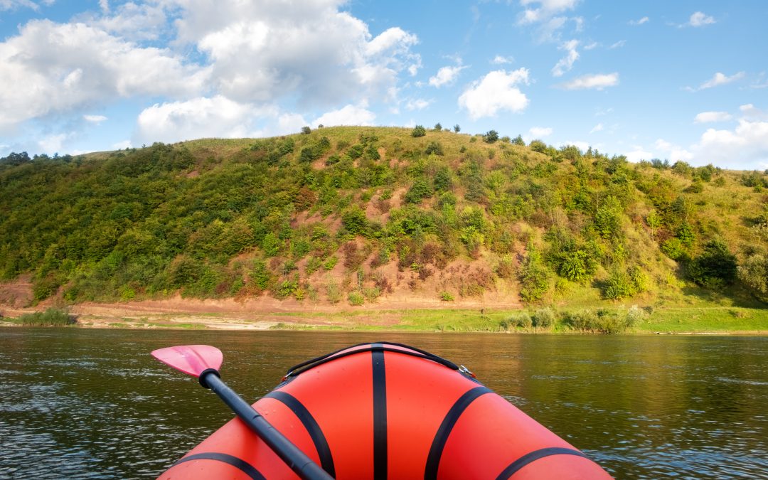 Healing in Nature: POV Sitting in orange raft on a river